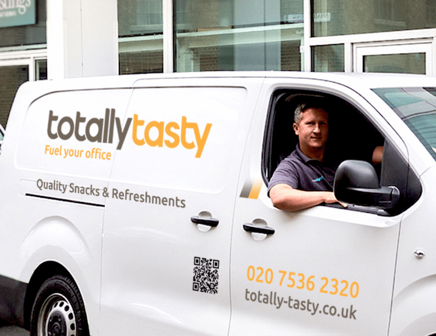 An image of Totally Tasty's van featuring the branding and 'Fuel your office' tag line