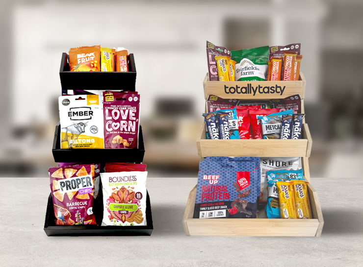 Image of two Totally Tasty snack displays containing lots of different healthy office snacks on a counter top