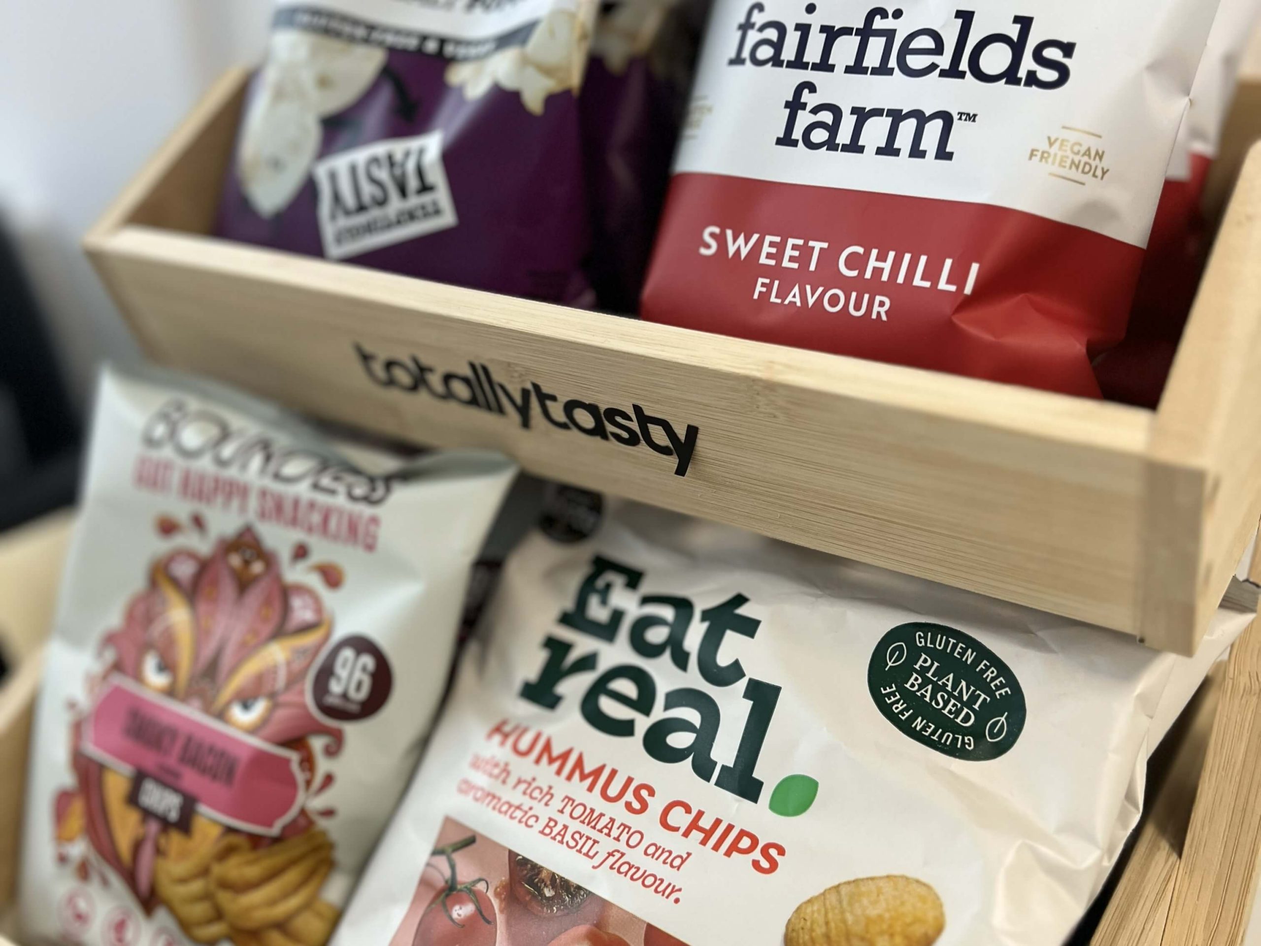A Totally Tasty snack rack with a range of alternative crisp options from Eat real and Boundless. It includes also includes other snacks from the article A new generation of healthier snack ideas.